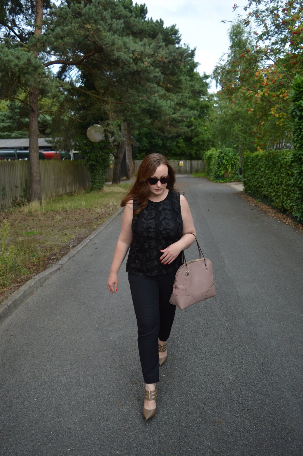 All Black Outfit With Taupe Shoes and Pink Bag