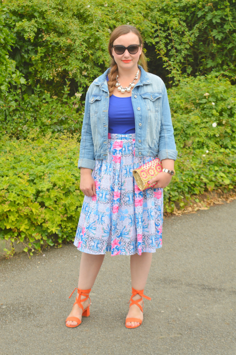 wearing a midi skirt with a denim jacket