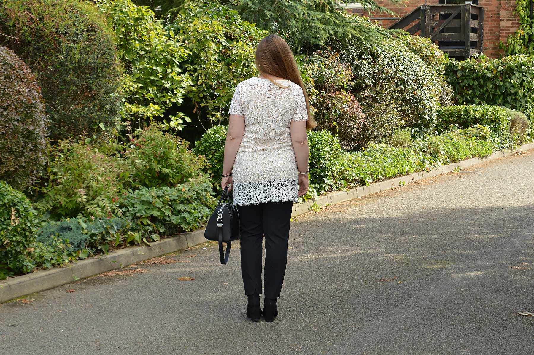 White lace tunic with black trousers
