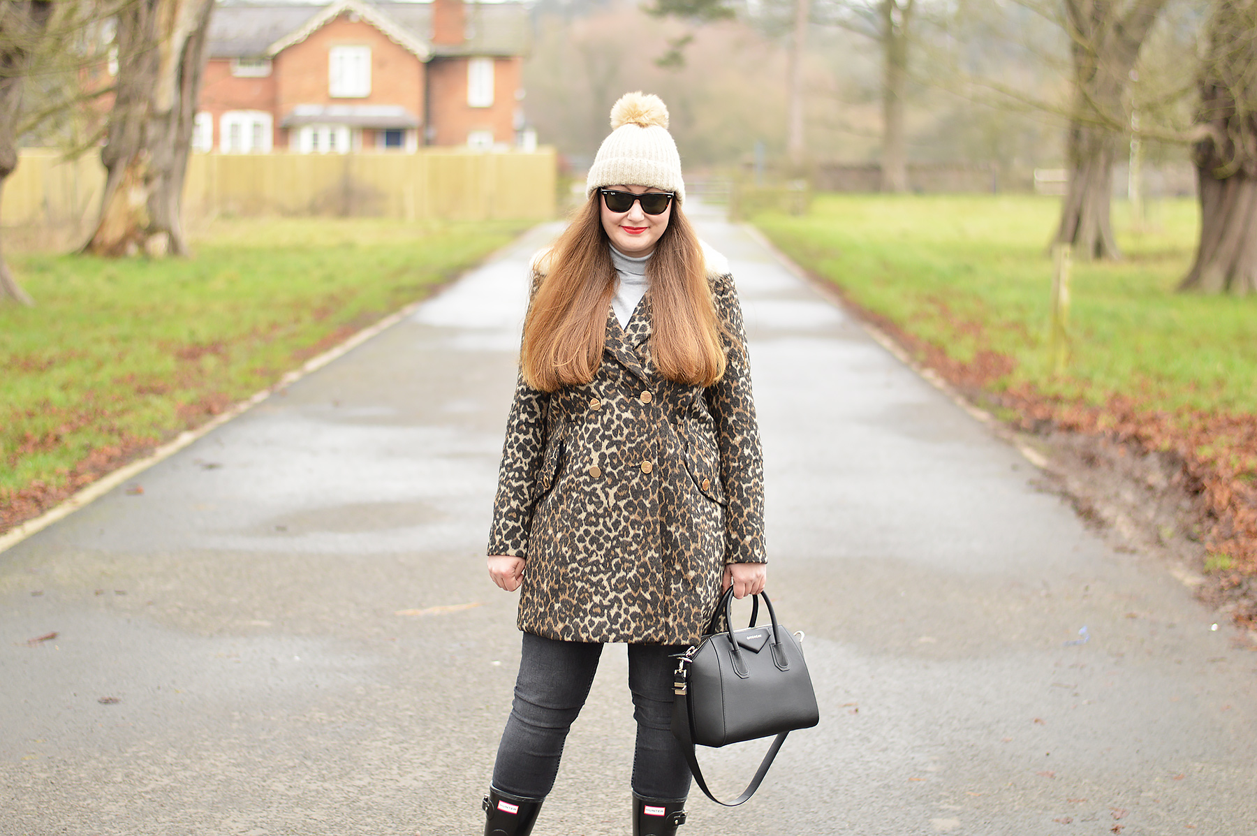 double breasted leopard print coat with gold buttons and grey turtleneck