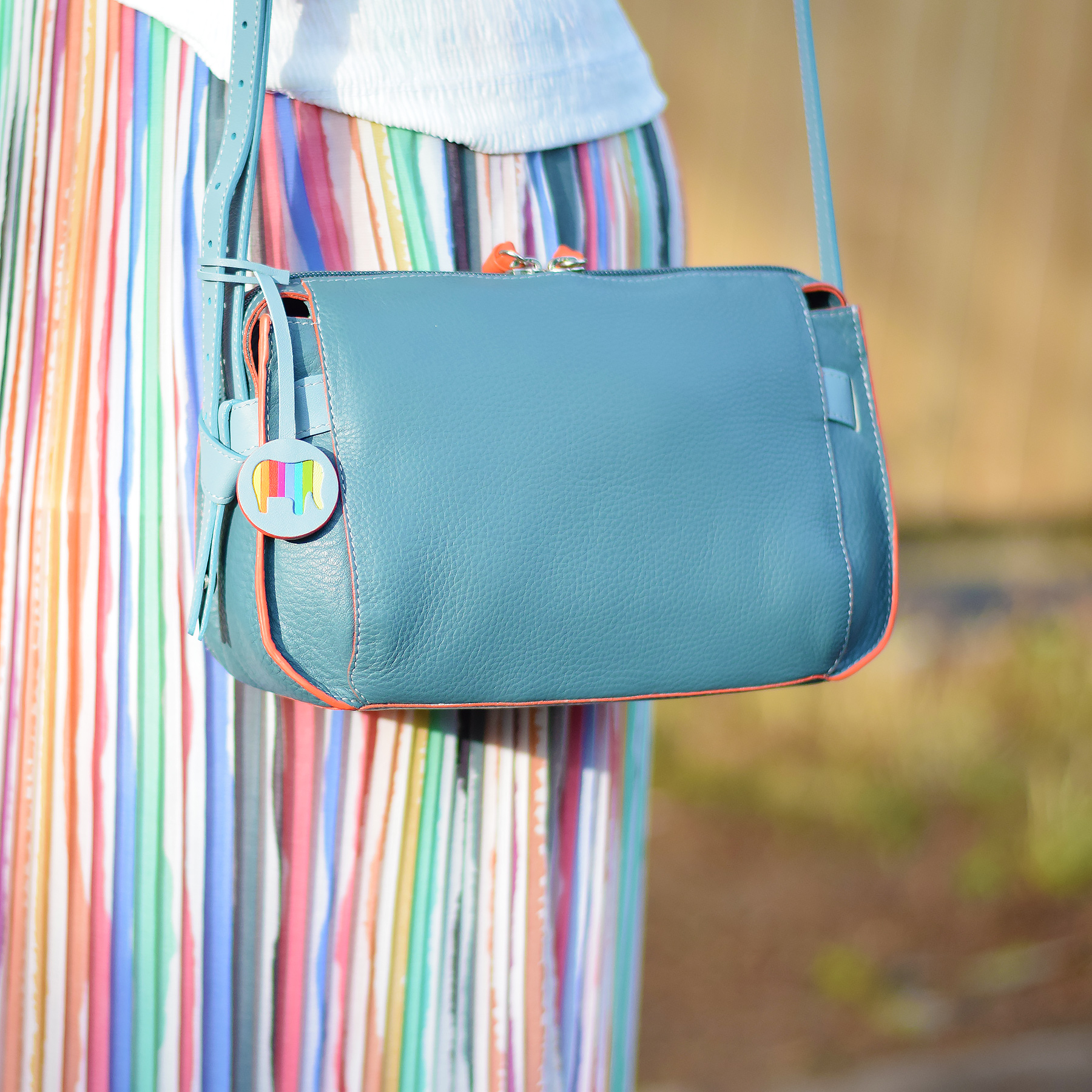 Outfit ideas for styling a light blue bag