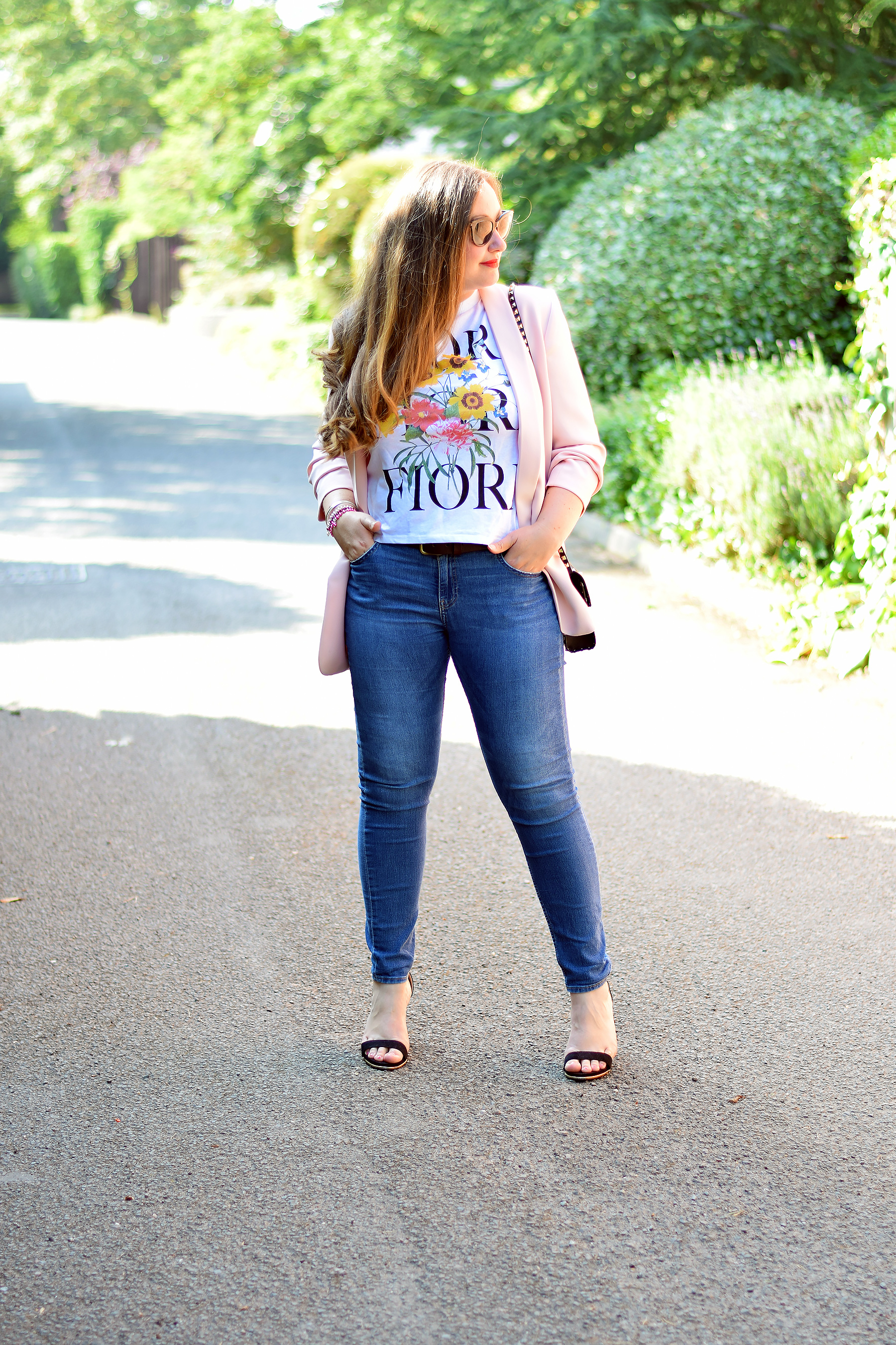 Gemma from Jacquard Flower Blog wearing Zara Flower printed tee and pink blazer with jeans and heels