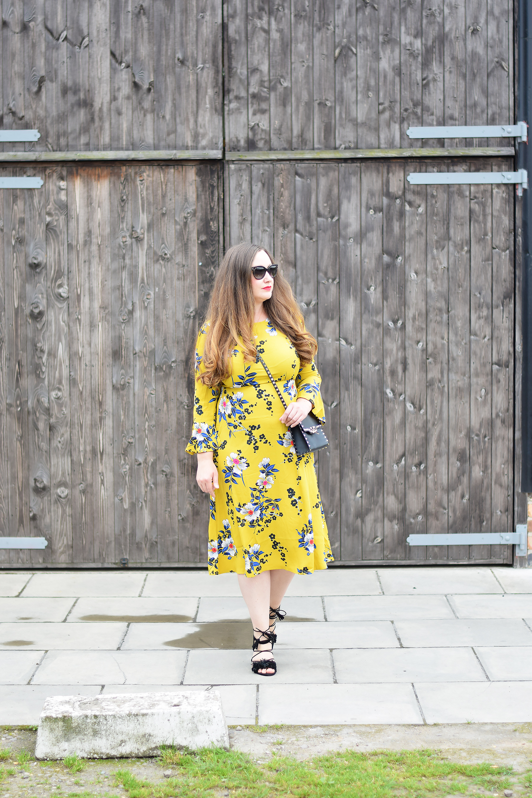 Gemma From Jacquard Flower Blog Wearing a mustard floral midi dress