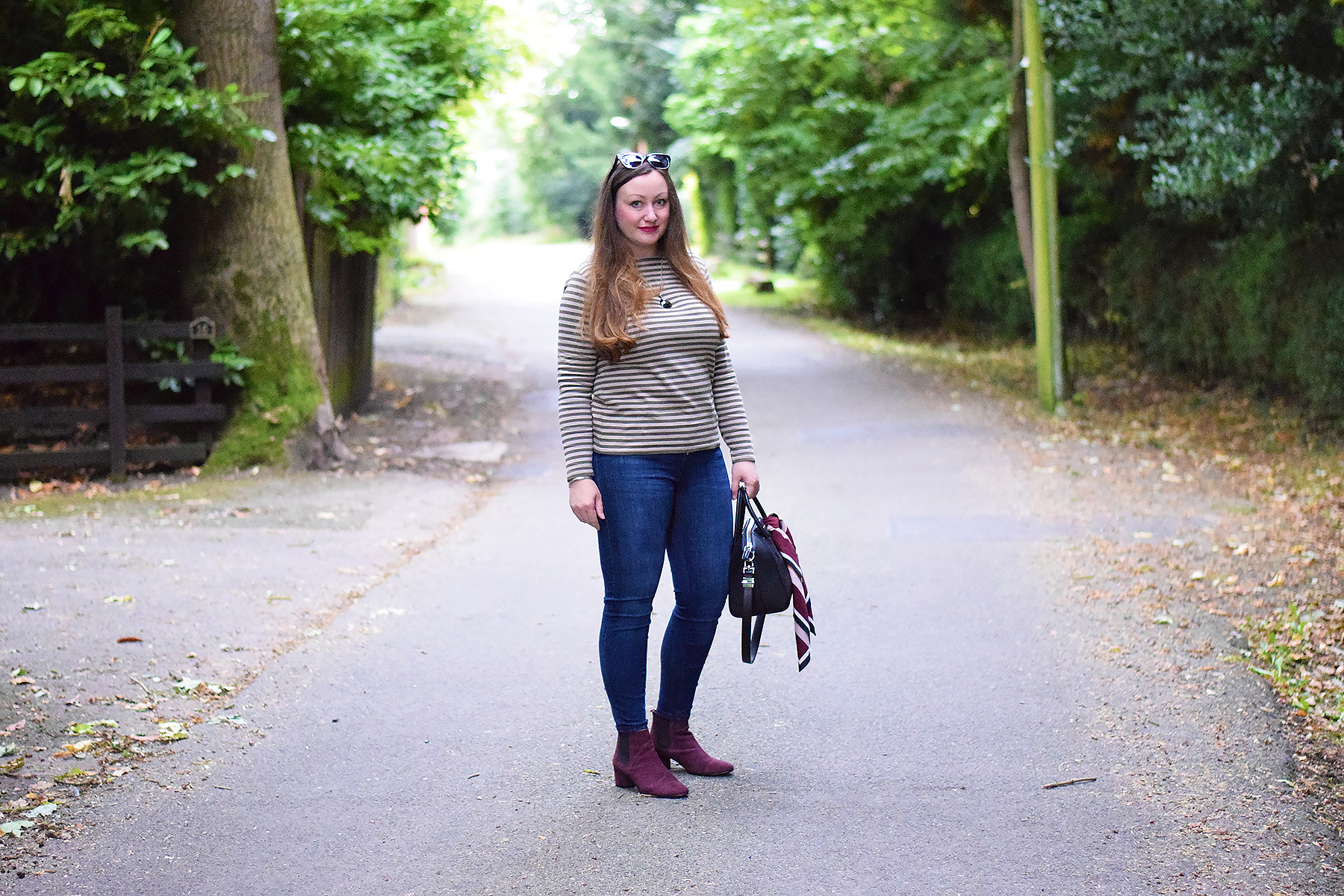 Green Striped top with jeans and burgundy boots