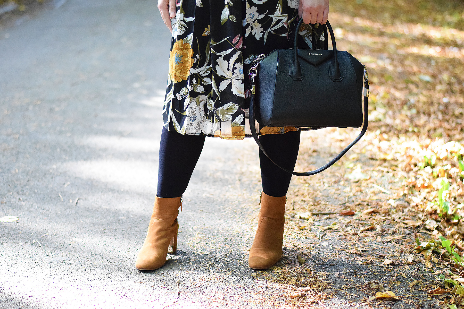 tan boots with black tights and midi dress