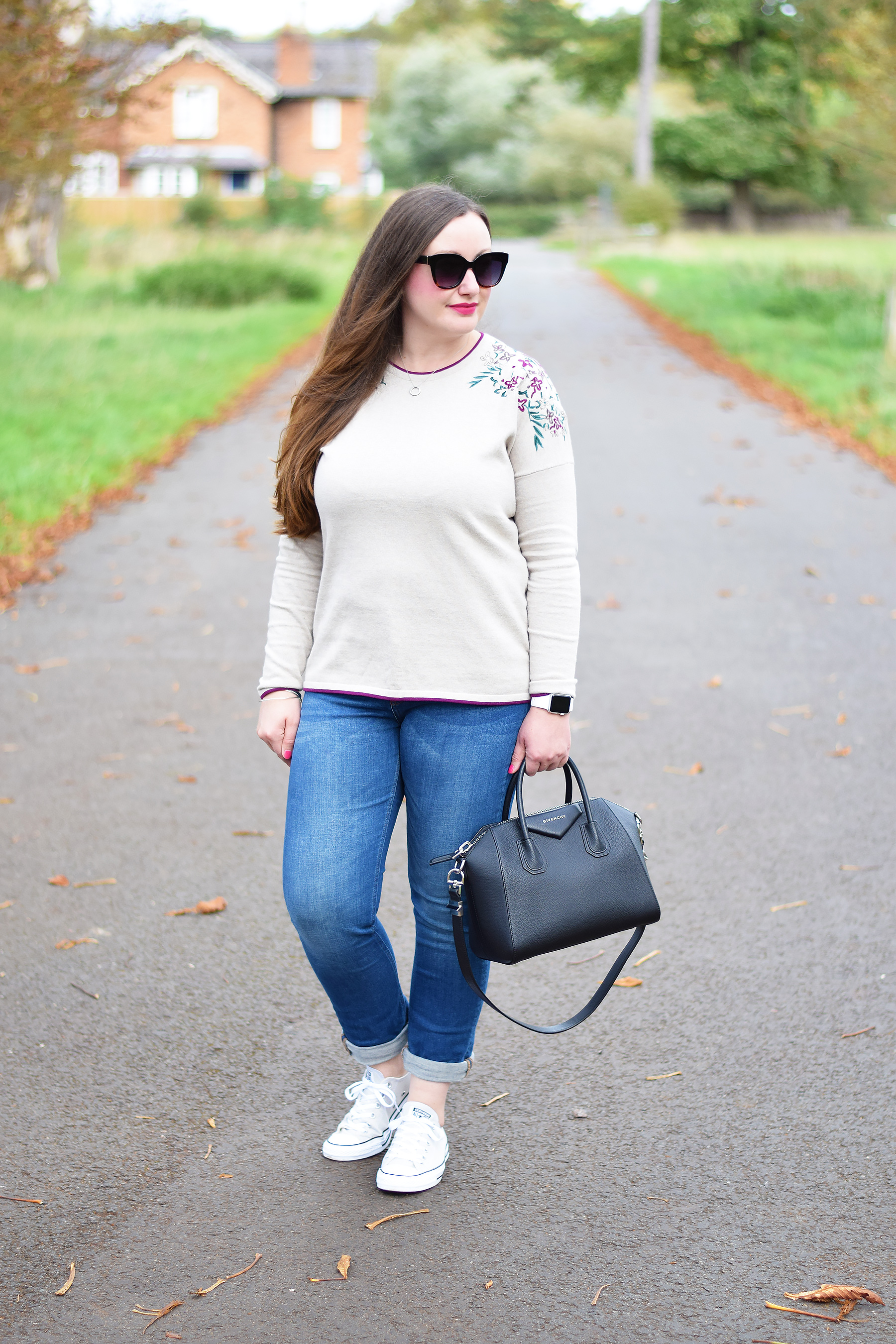 Embroidered jumper with jeans and trainers