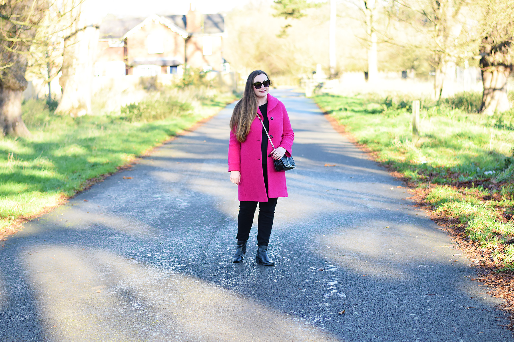 Pink coat with all black outfit