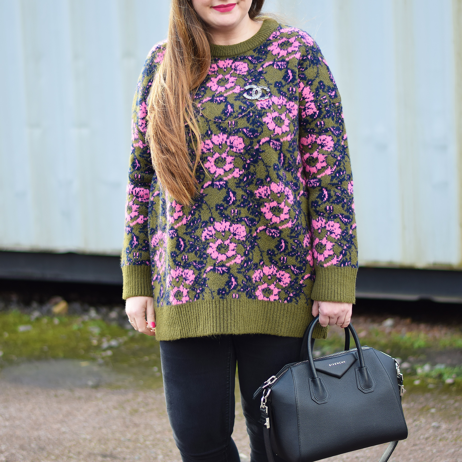 Cozy floral jumper outfit with designer handbag and brooch