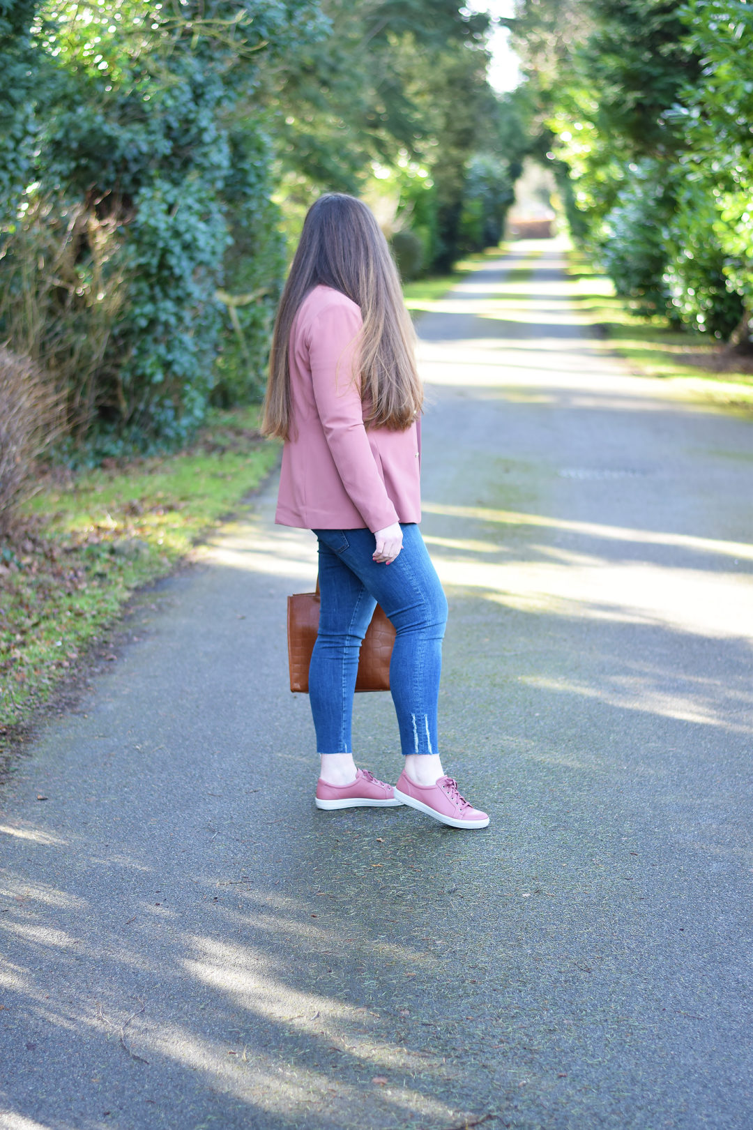 Zara distressed hem jeans with pink blazer and trainers