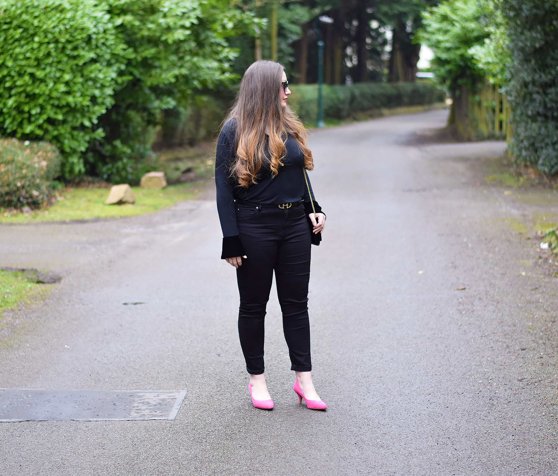 All black outfit with pink shoes