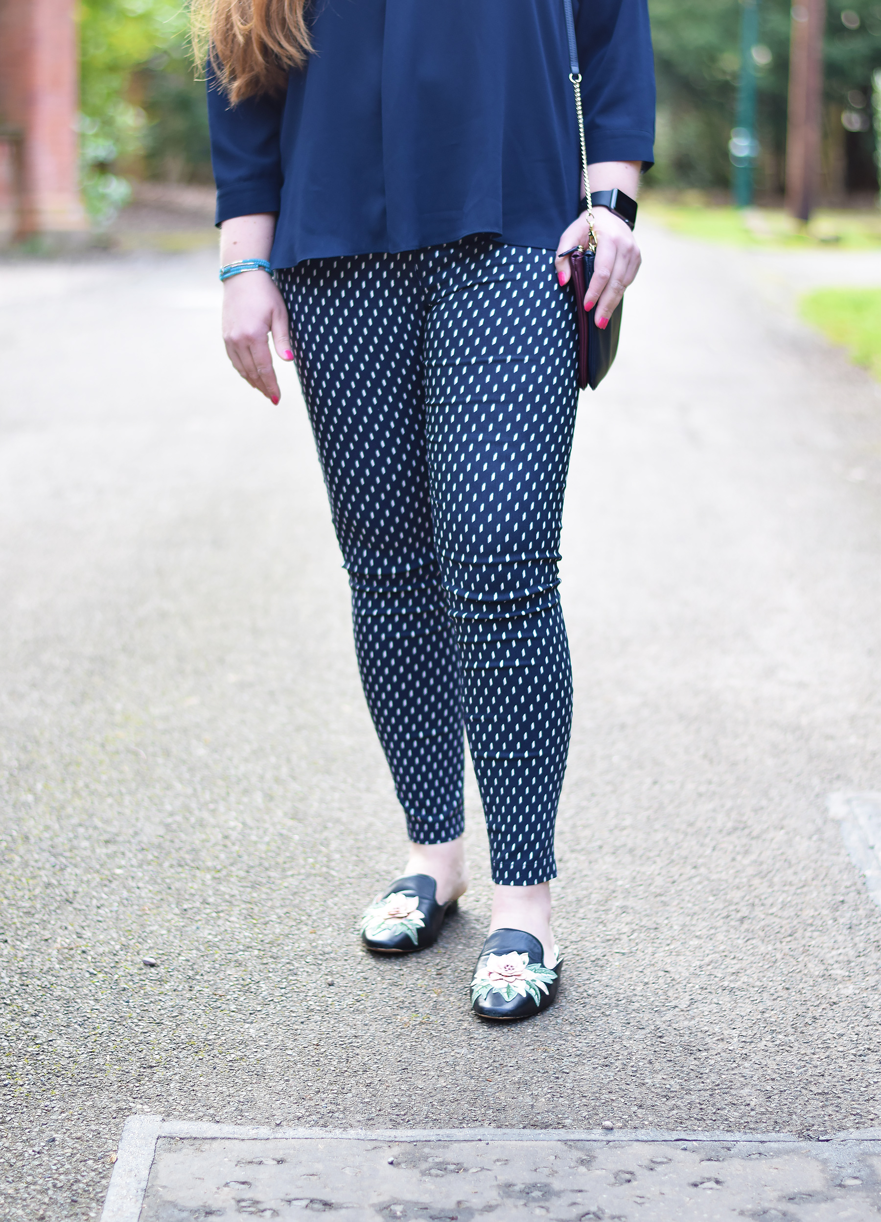 Patterned trousers and backless shoes 