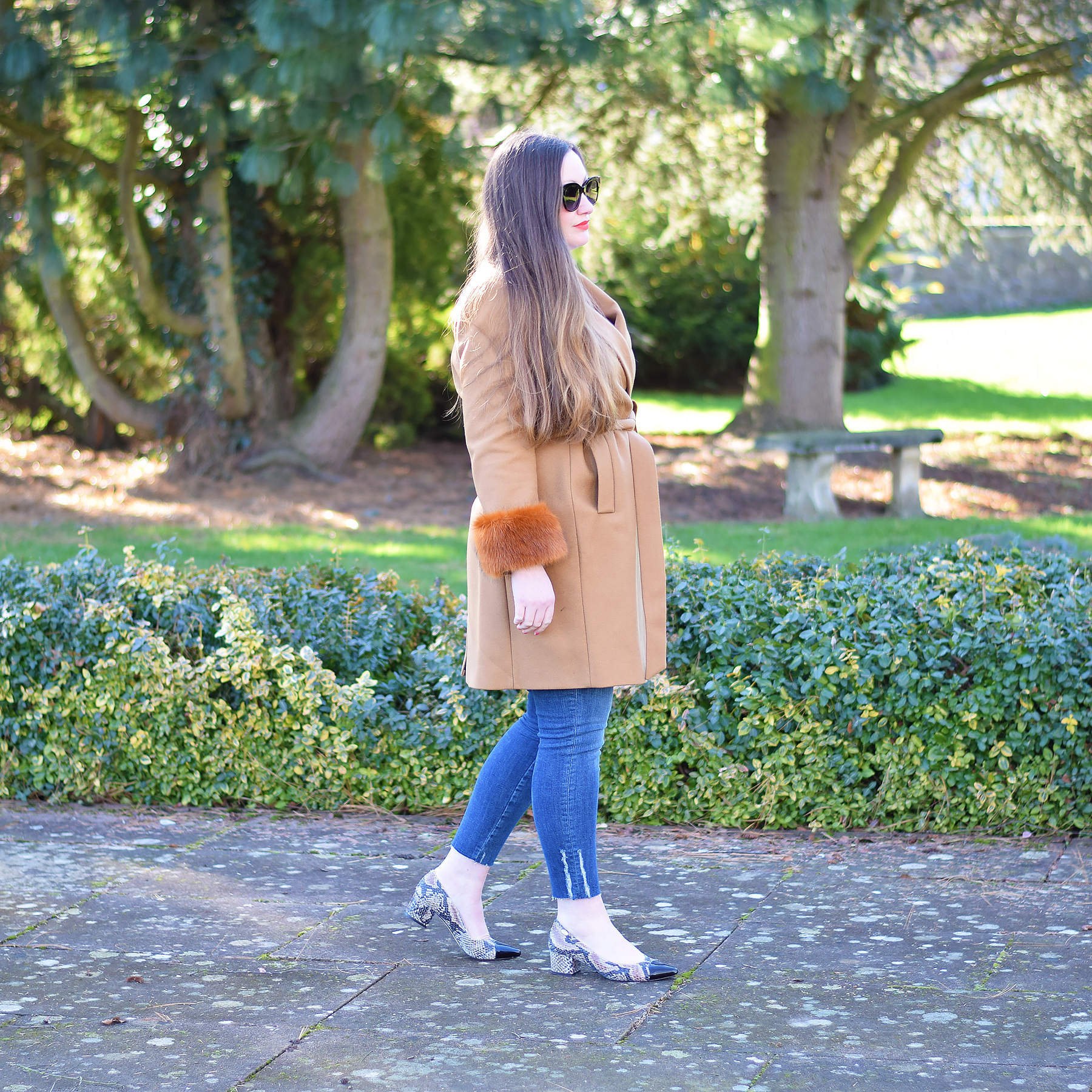 Zara caramel winter coat with faux fur details and distressed jeans 