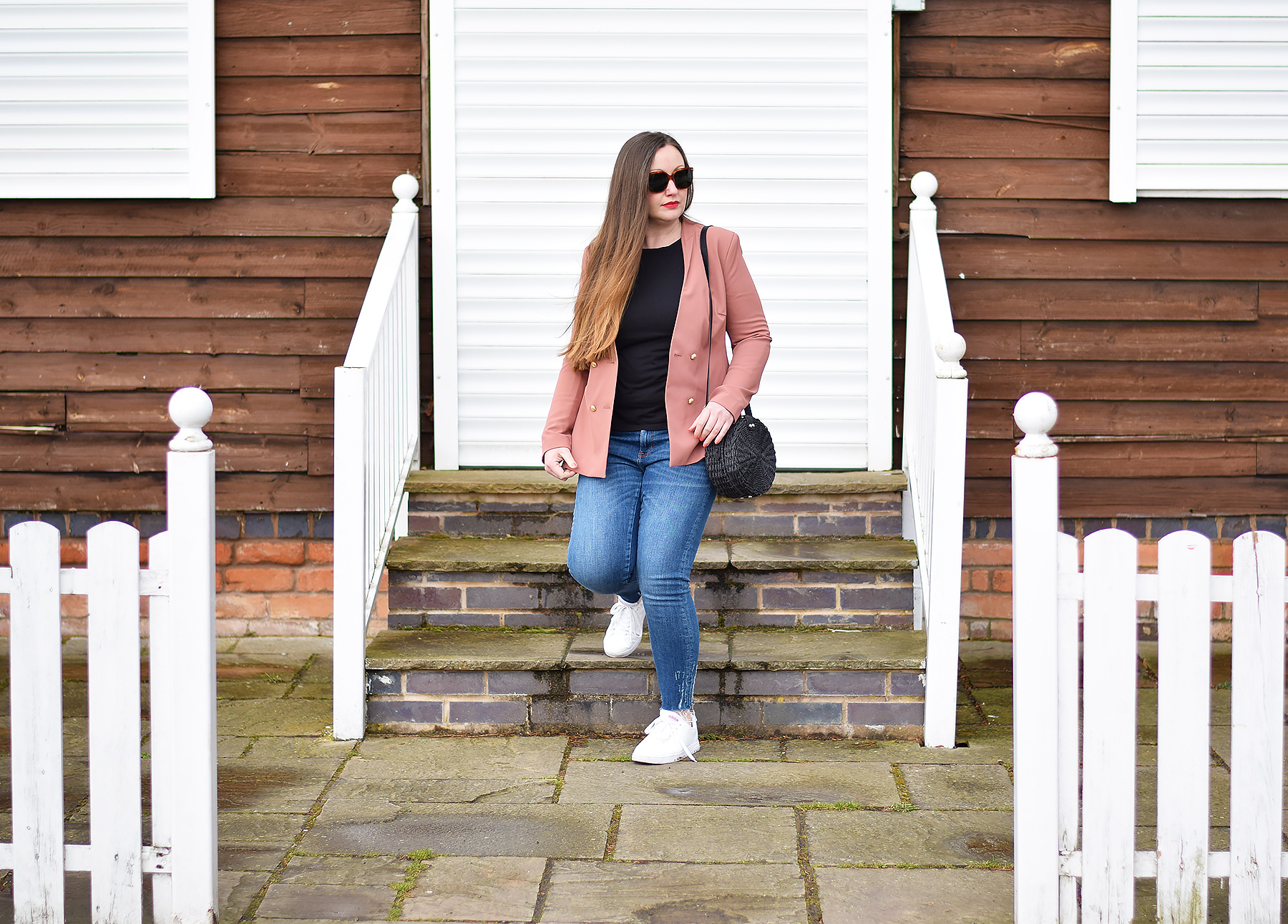 Zara terracotta blazer and jeans with trainers and a basket bag