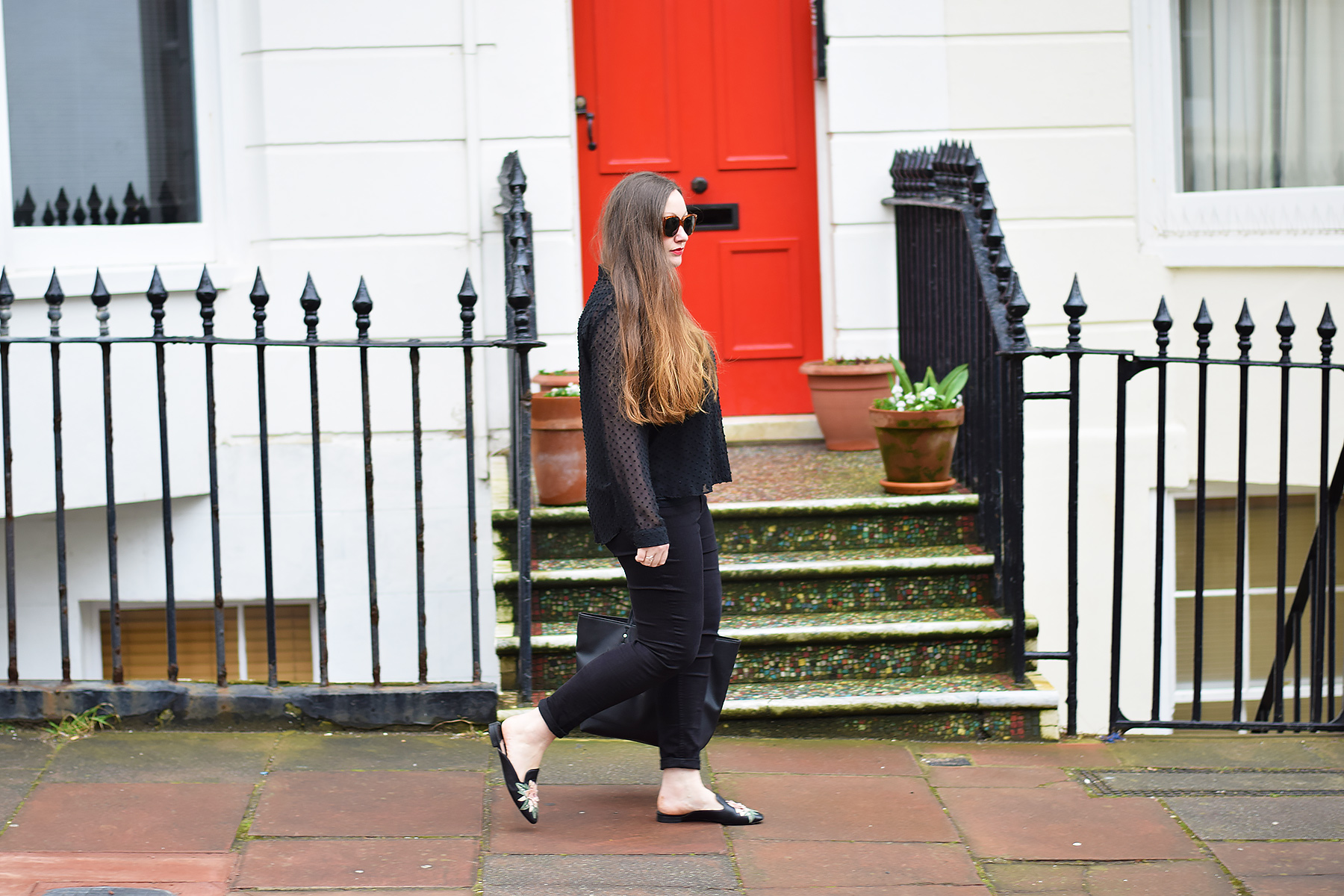 Black outfit with a statement shoe