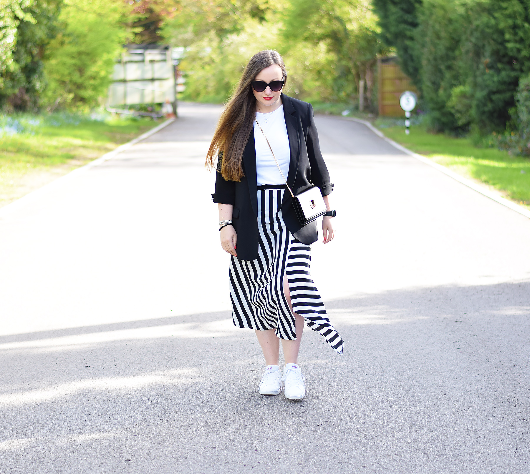 Three ways to style a black blazer with striped skirt