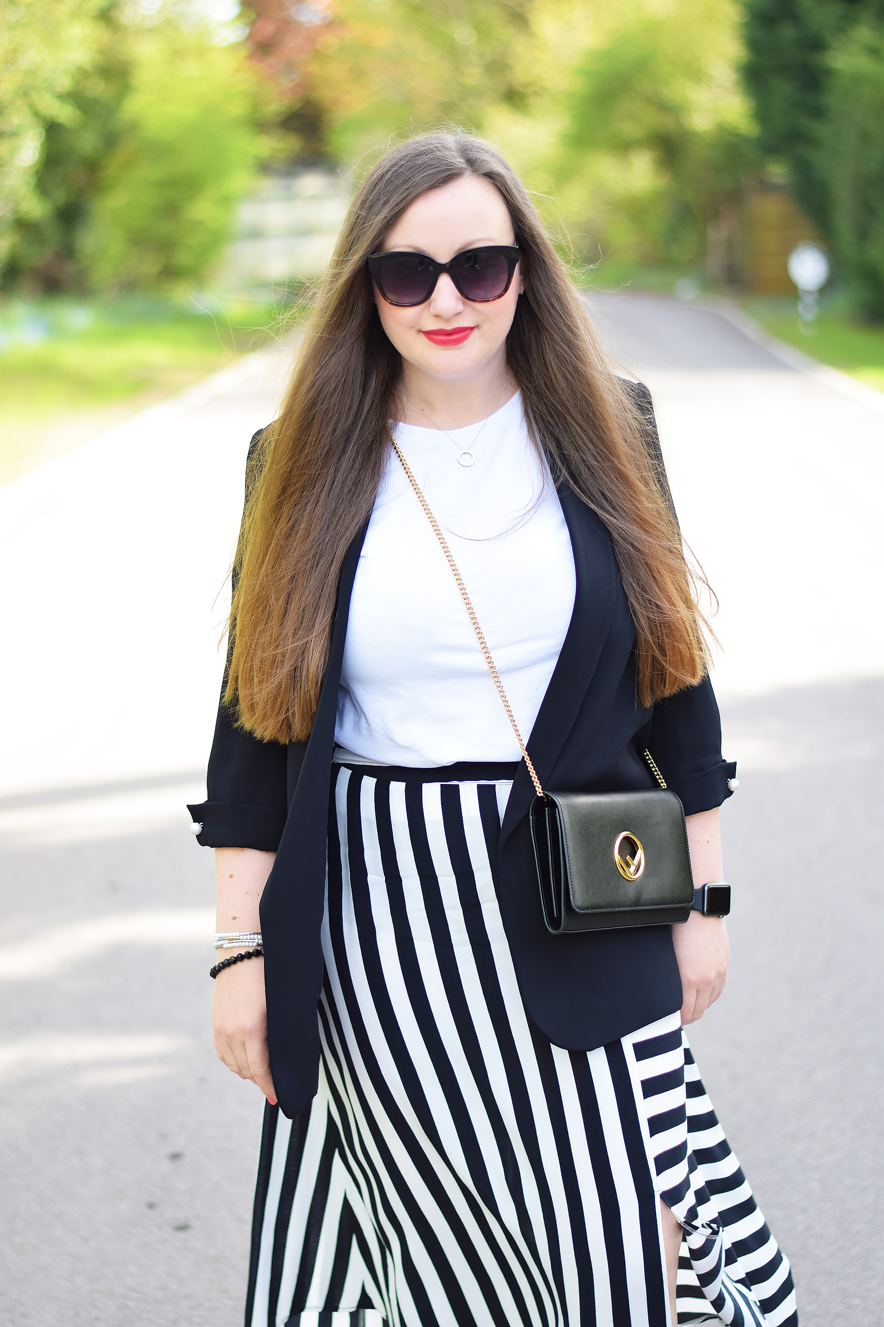 Zara black blazer with striped skirt and fendi bag