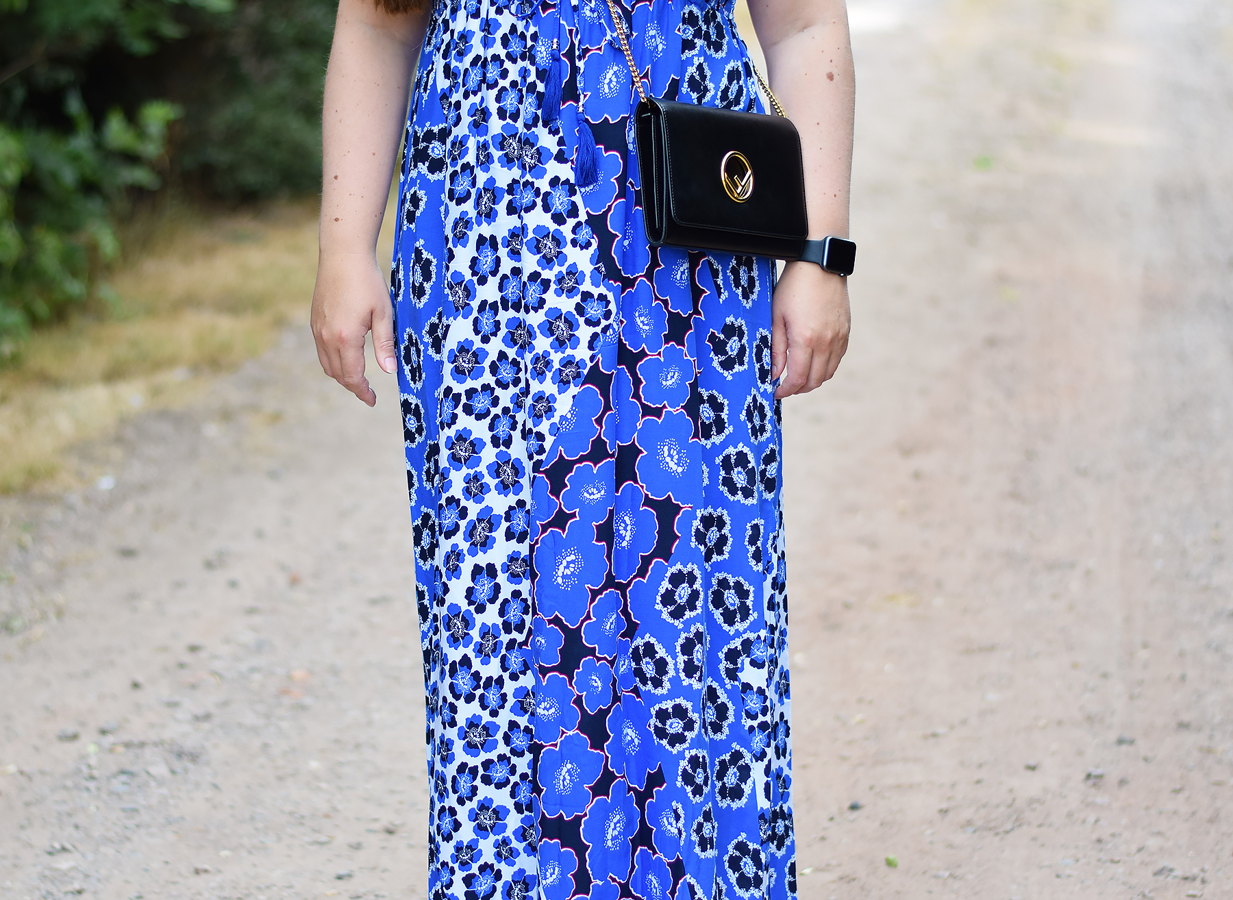 Fendi crossbody bag with blue floral maxi dress