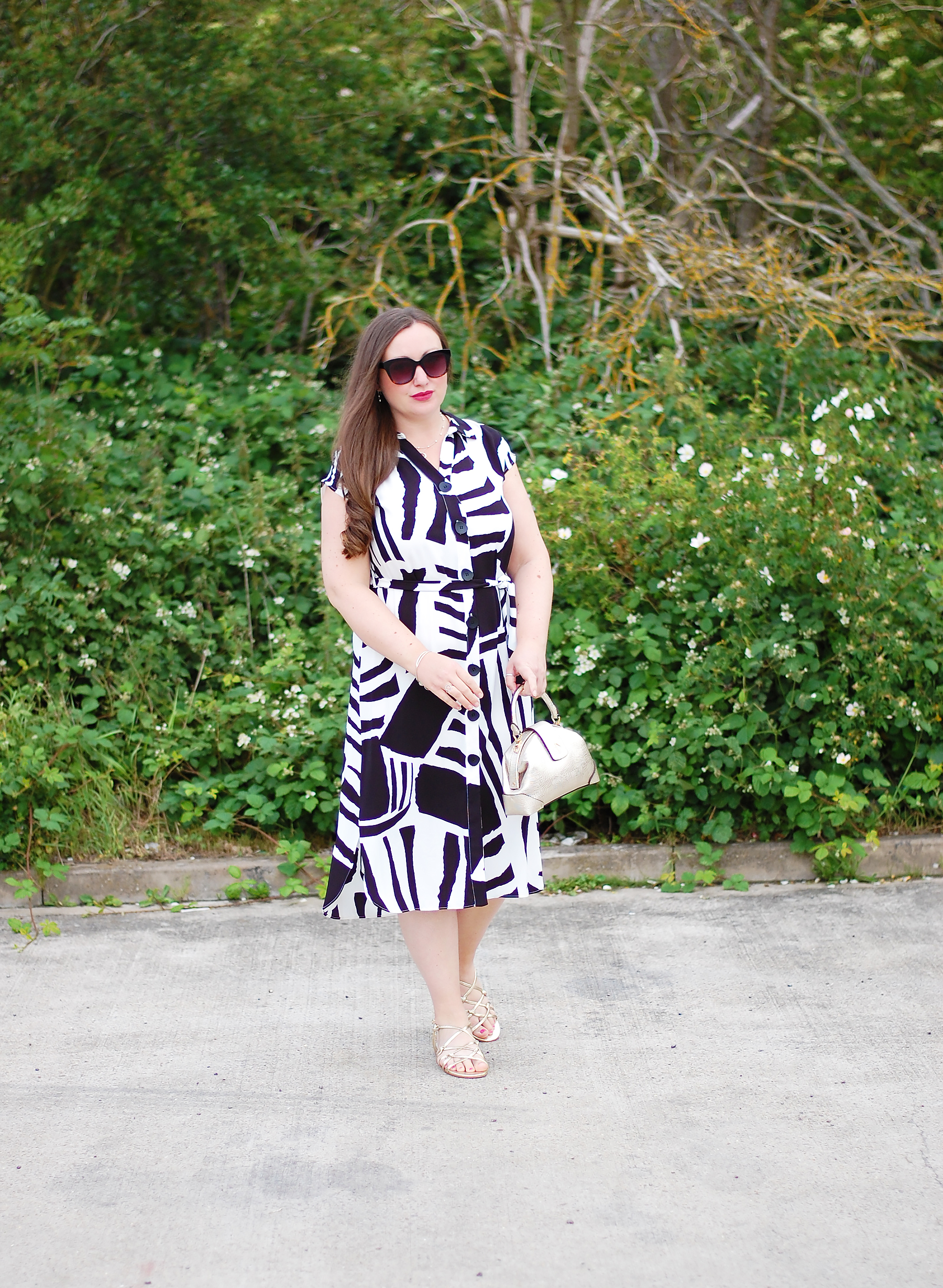 Midi dress outfit with gold bag and sandals