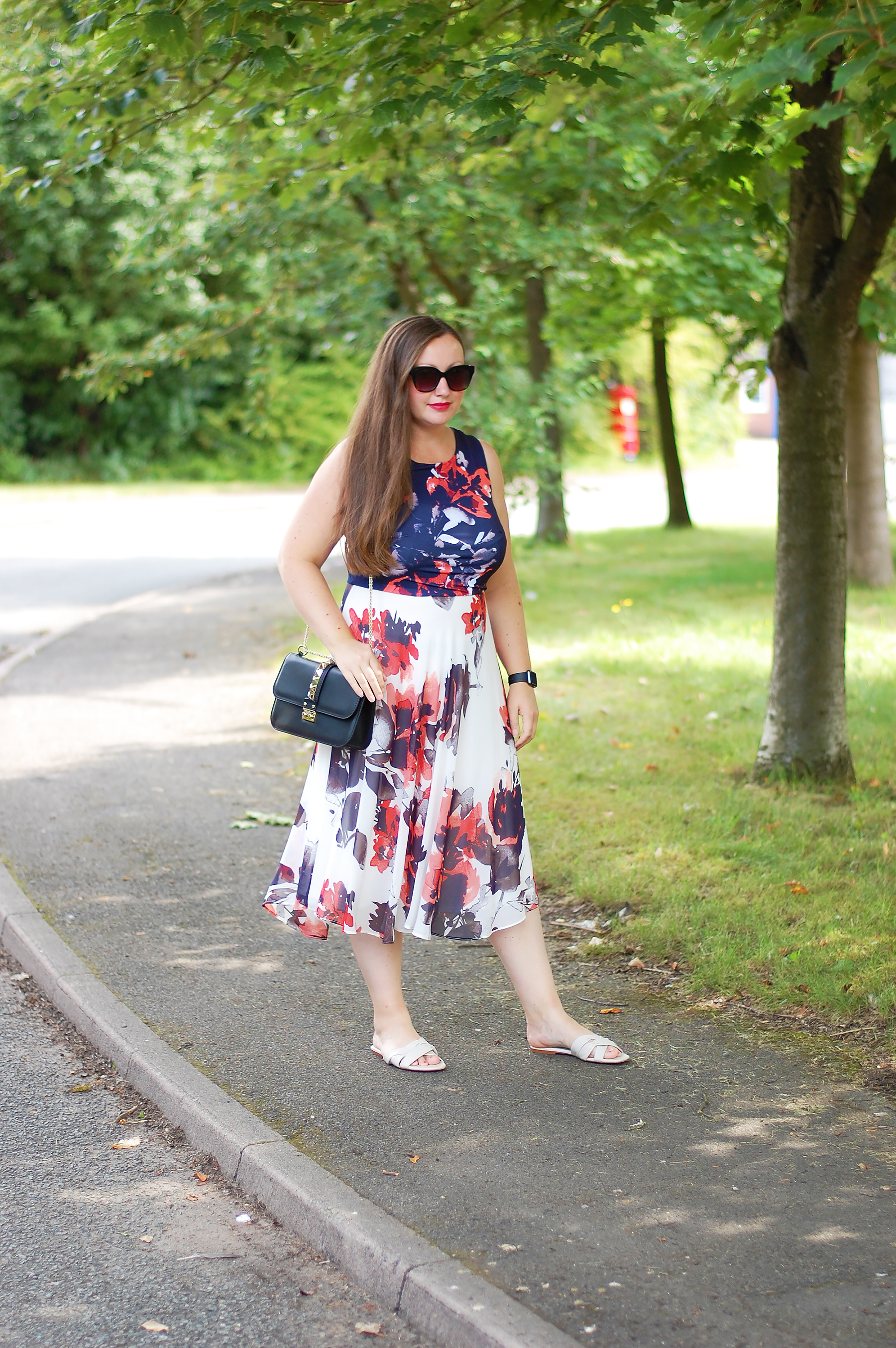 Navy Red and white floral dress with Valentino Glam lock Bag