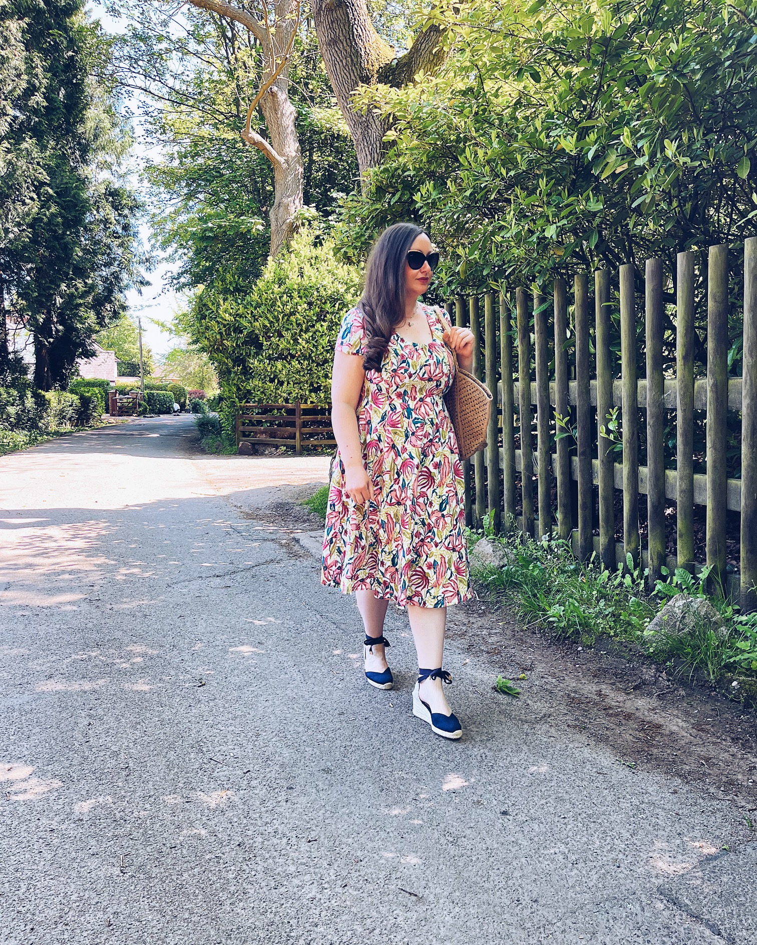 Nomads Floral Midi Dress with espadrilles and a jute bag