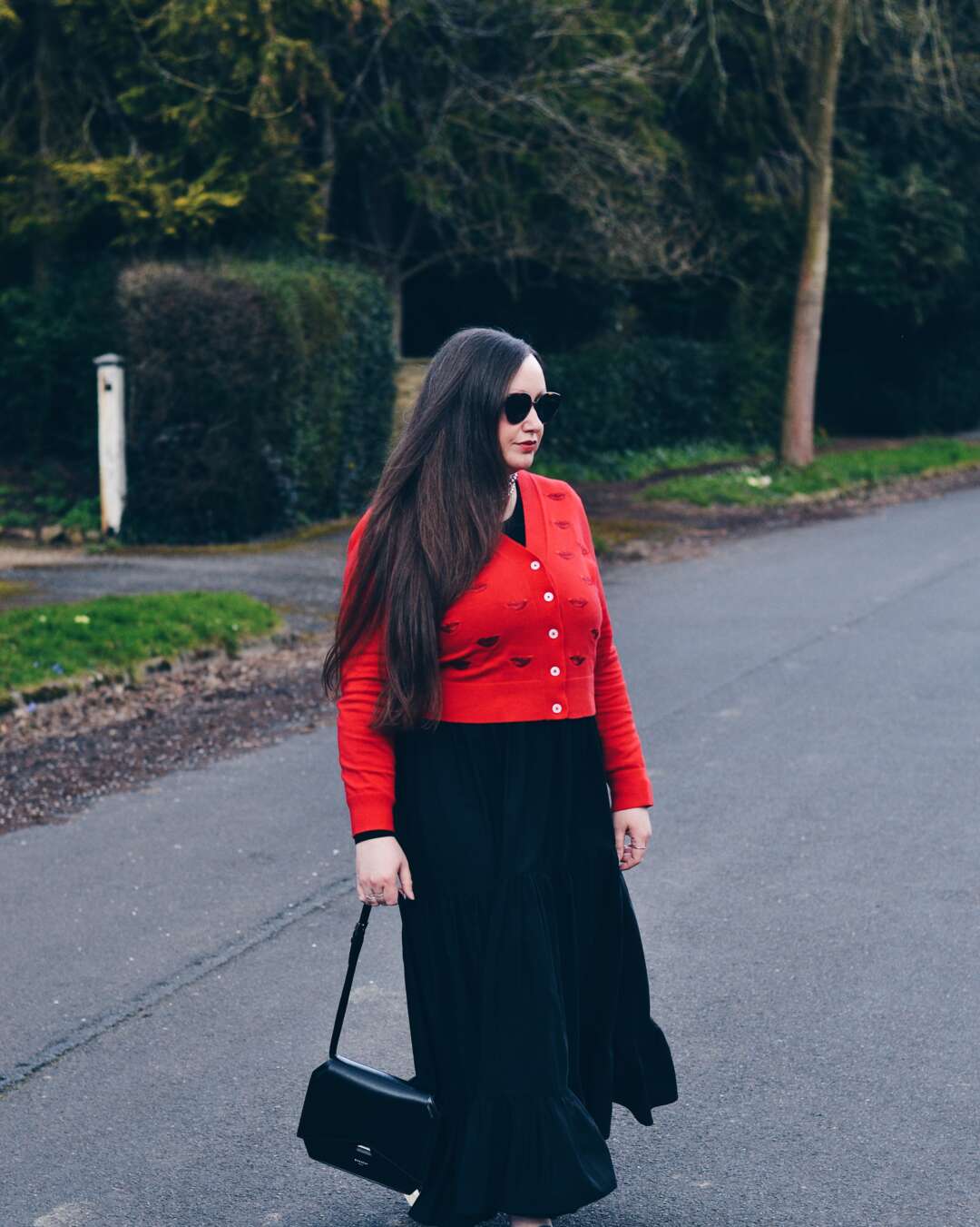 How to style a red V neck cardigan