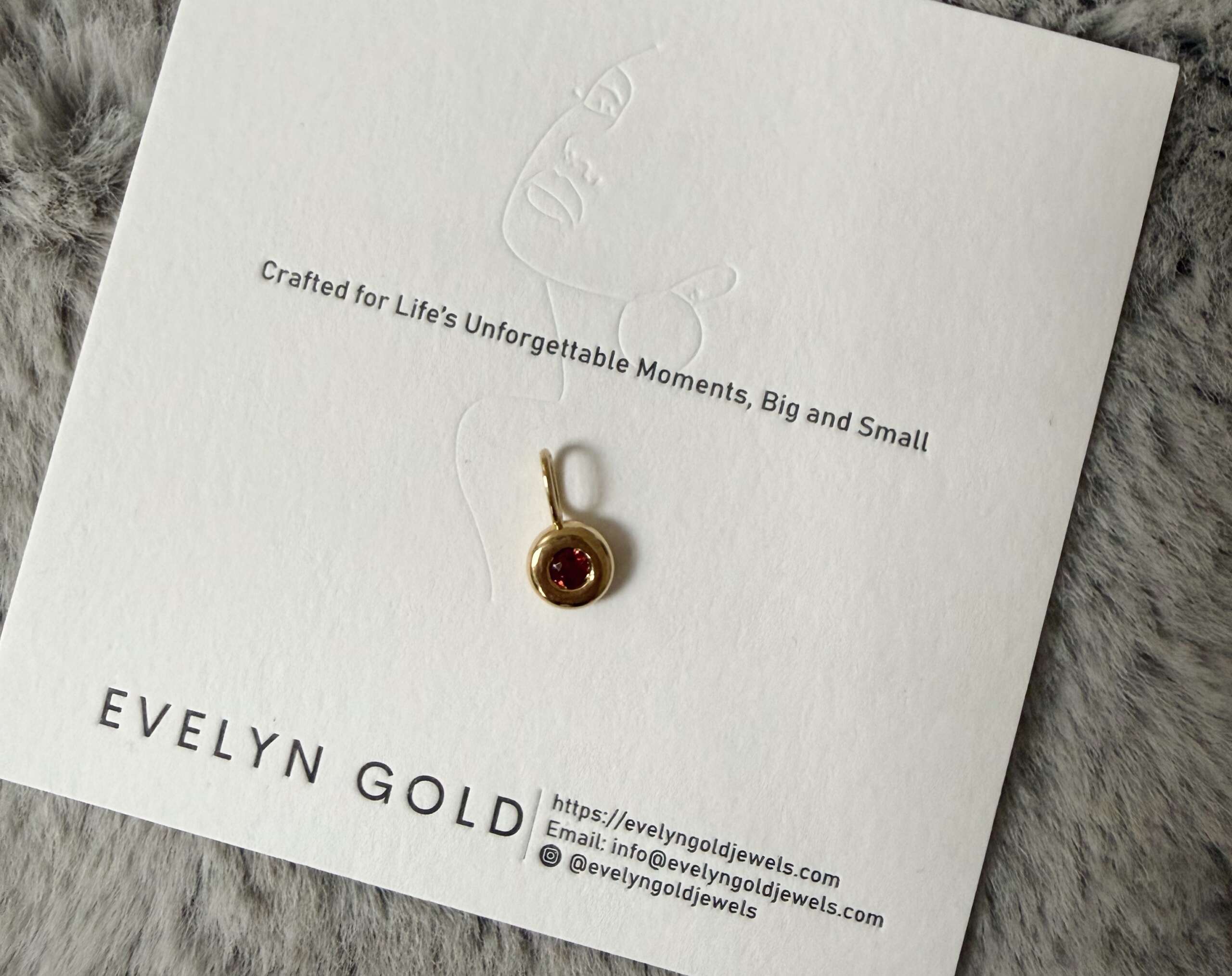 Evelyn Gold Signature Pebble Birthstone Pendant for January Garnet and solid gold